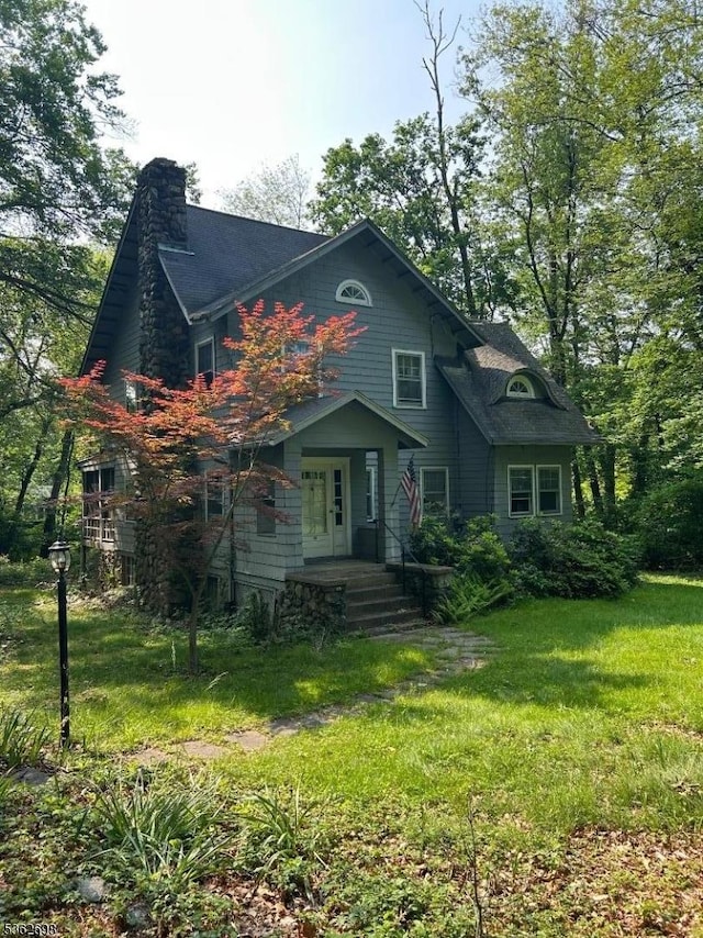 44 Hanover Rd, Mountain Lakes Boro, NJ 07046 - view of front facade featuring a chimney and a front yard