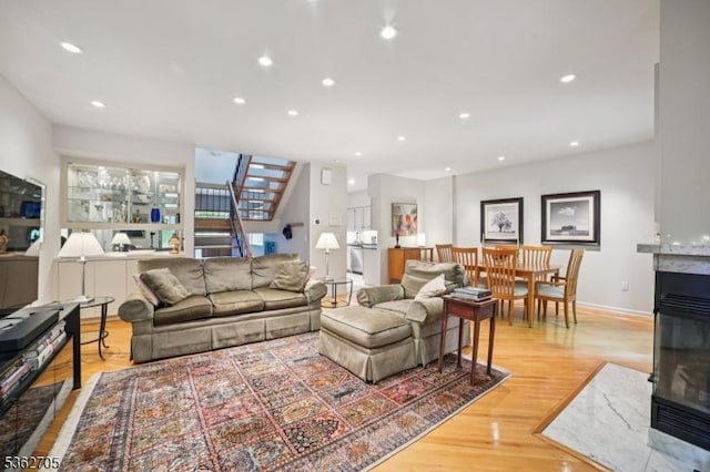 30 Andrea Dr Unit 30, North Caldwell Boro, NJ 07006 - living room featuring stairway, light wood-style flooring, recessed lighting, baseboards, and a multi sided fireplace