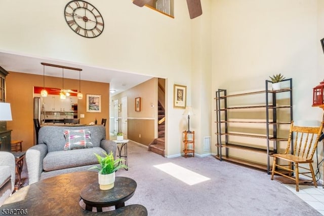 6 Pelican Pt, Hampton Twp, NJ 07860 - living area with ceiling fan, stairway, a towering ceiling, carpet, and baseboards