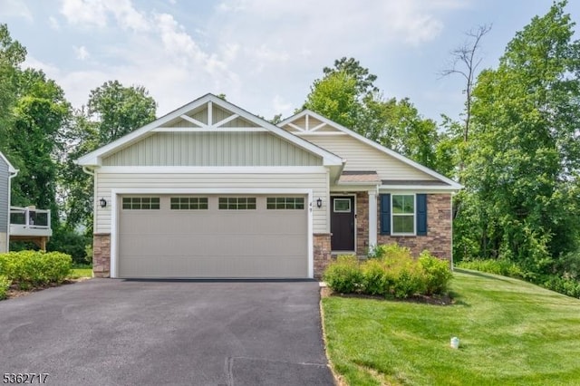 49 Coventry Rd, Hardyston Twp, NJ 07419 - craftsman inspired home with an attached garage, board and batten siding, a front lawn, asphalt driveway, and stone siding