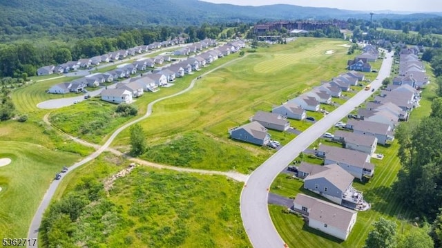 49 Coventry Rd, Hardyston Twp, NJ 07419 - aerial view of residential area featuring a golf course, a heavily wooded area, and a mountain backdrop