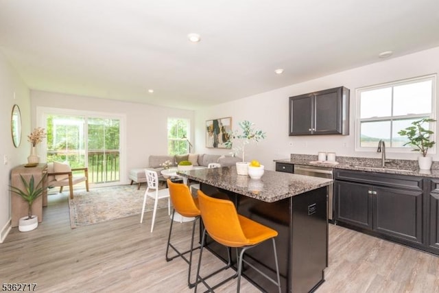49 Coventry Rd, Hardyston Twp, NJ 07419 - kitchen featuring a center island, a sink, light wood-type flooring, light stone counters, and recessed lighting