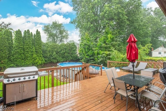 17 Barnida Dr, East Hanover Twp, NJ 07936 - deck with outdoor dining area, an outdoor pool, area for grilling, and view of scattered trees