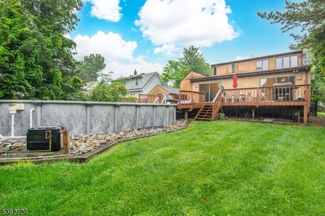 17 Barnida Dr, East Hanover Twp, NJ 07936 - view of green lawn featuring a deck