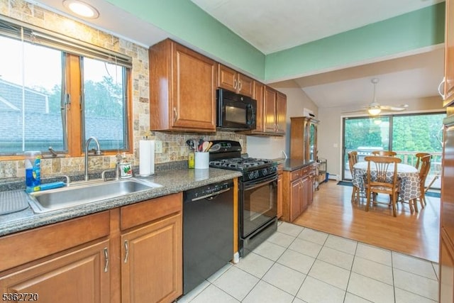 17 Barnida Dr, East Hanover Twp, NJ 07936 - kitchen with black appliances, brown cabinetry, light tile patterned flooring, lofted ceiling, and ceiling fan