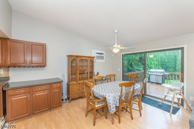 17 Barnida Dr, East Hanover Twp, NJ 07936 - dining area featuring light wood-type flooring, a ceiling fan, a wall mounted air conditioner, and vaulted ceiling