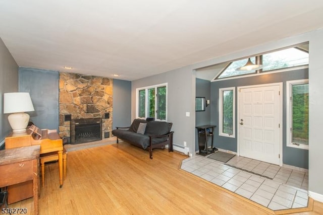 17 Barnida Dr, East Hanover Twp, NJ 07936 - foyer with a stone fireplace, light wood finished floors, and baseboard heating
