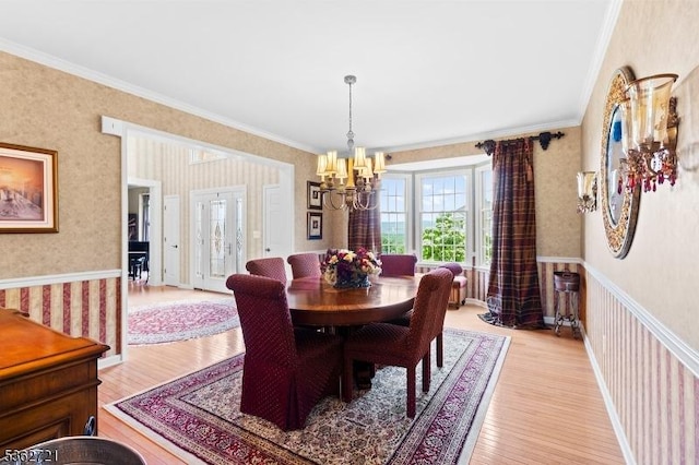 2 Skyview Dr, Sparta Twp, NJ 07871 - dining space featuring wallpapered walls, a chandelier, crown molding, and light wood finished floors
