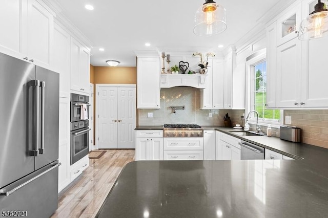 2 Skyview Dr, Sparta Twp, NJ 07871 - kitchen with appliances with stainless steel finishes, a sink, dark countertops, white cabinets, and light wood-style flooring