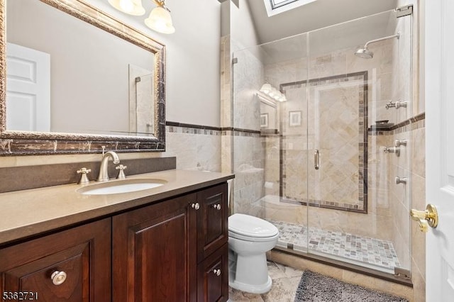 2 Skyview Dr, Sparta Twp, NJ 07871 - full bathroom featuring toilet, vanity, a shower stall, tile patterned flooring, and tile walls