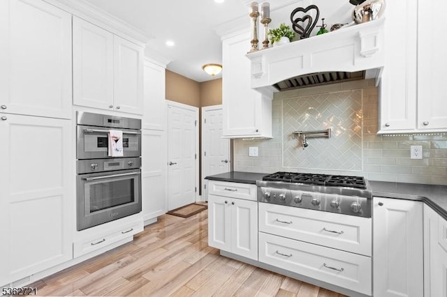 2 Skyview Dr, Sparta Twp, NJ 07871 - kitchen with appliances with stainless steel finishes, dark countertops, white cabinets, tasteful backsplash, and recessed lighting
