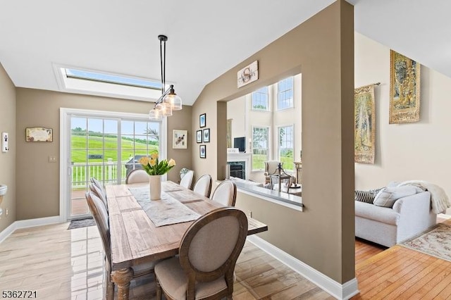 2 Skyview Dr, Sparta Twp, NJ 07871 - dining space with vaulted ceiling, healthy amount of natural light, light wood-style flooring, baseboards, and a chandelier