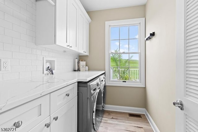 2 Skyview Dr, Sparta Twp, NJ 07871 - washroom with cabinet space, baseboards, washing machine and dryer, and light wood finished floors