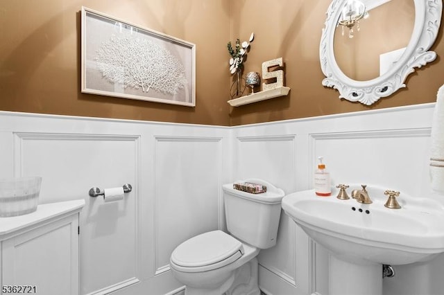 2 Skyview Dr, Sparta Twp, NJ 07871 - bathroom with a wainscoted wall, toilet, a decorative wall, and a sink