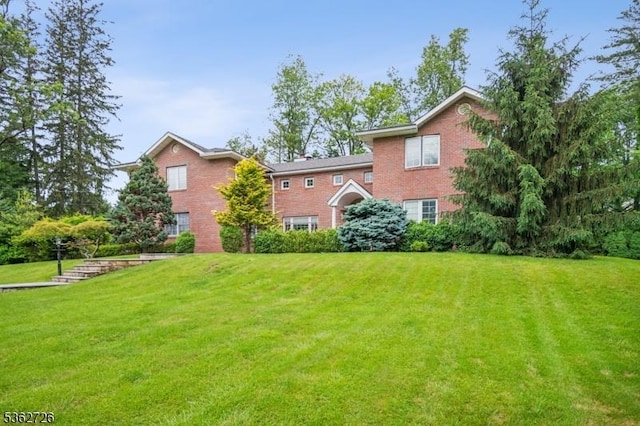 61 Joanna Way, Millburn Twp, NJ 07078 - rear view of house featuring a lawn and brick siding