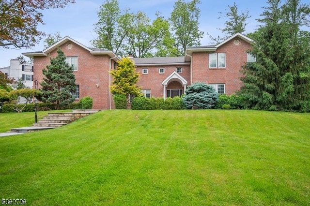 61 Joanna Way, Millburn Twp, NJ 07078 - view of front facade with brick siding and a front yard