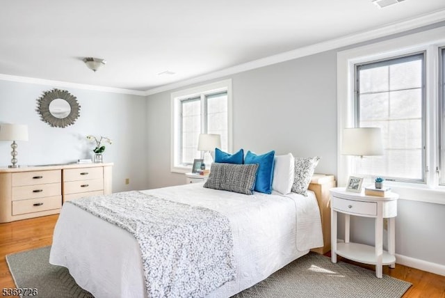 61 Joanna Way, Millburn Twp, NJ 07078 - bedroom with ornamental molding, light wood-style flooring, multiple windows, and baseboards