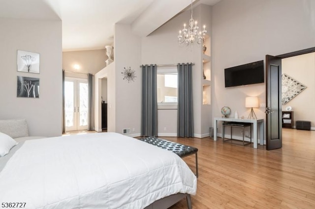 27 Mare Haven Ct, North Brunswick Twp, NJ 08902 - bedroom with multiple windows, wood finished floors, french doors, and a chandelier