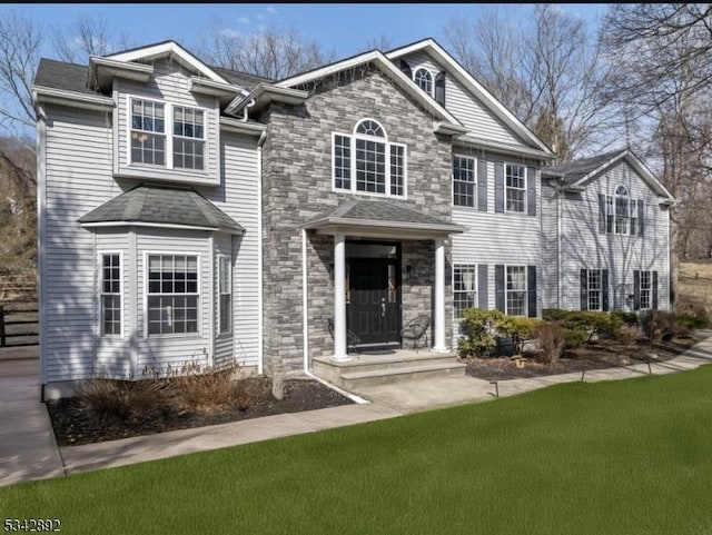 522 Stanhope Rd, Byram Twp, NJ 07871 - traditional-style home featuring a front yard and stone siding