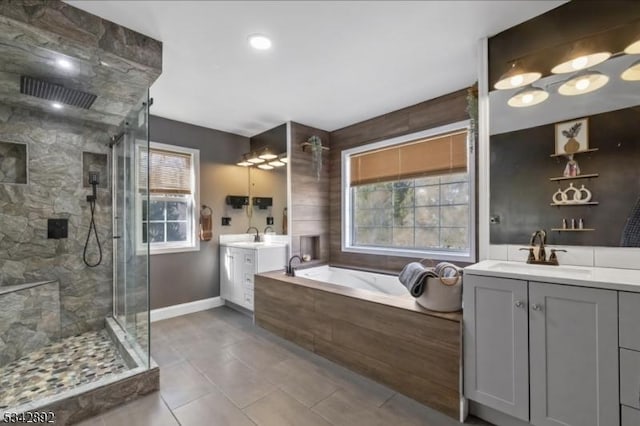 522 Stanhope Rd, Byram Twp, NJ 07871 - bathroom with a shower stall, a bath, two vanities, and tile patterned flooring
