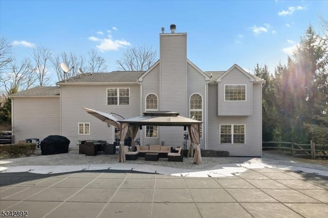522 Stanhope Rd, Byram Twp, NJ 07871 - rear view of property with outdoor lounge area, a gazebo, a patio, a covered pool, and a chimney