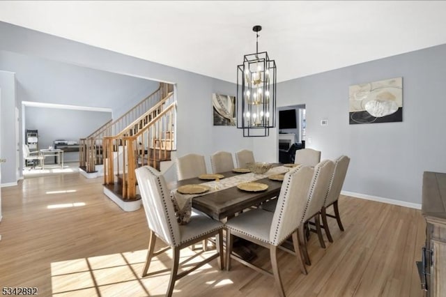 522 Stanhope Rd, Byram Twp, NJ 07871 - dining space featuring light wood-style floors, stairway, and a chandelier