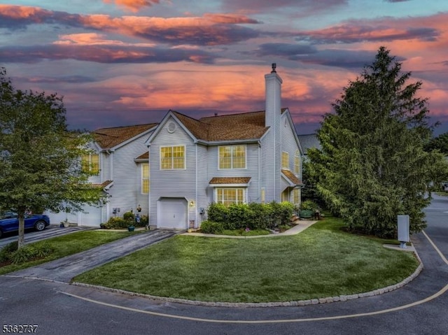 17 Willow Cir, Hamburg Boro, NJ 07419 - traditional home with driveway, a garage, a chimney, and a front yard