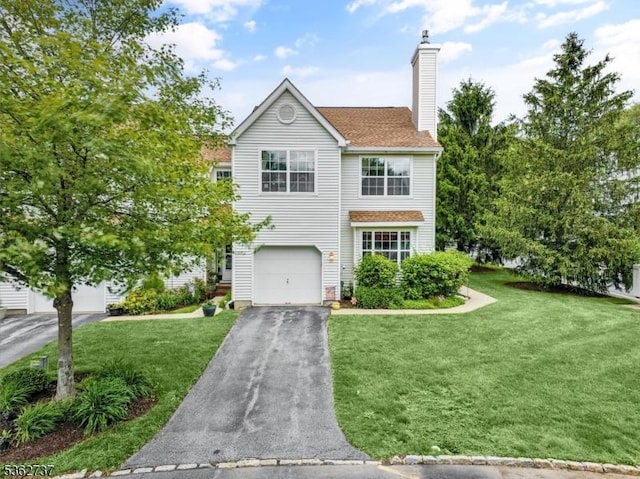 17 Willow Cir, Hamburg Boro, NJ 07419 - traditional home with asphalt driveway, a chimney, a front lawn, and an attached garage