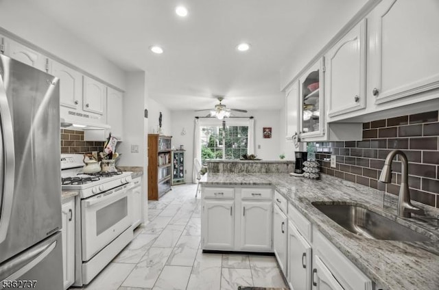 17 Willow Cir, Hamburg Boro, NJ 07419 - kitchen with freestanding refrigerator, white range with gas cooktop, a sink, under cabinet range hood, and white cabinets