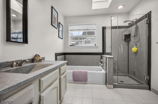 17 Willow Cir, Hamburg Boro, NJ 07419 - full bathroom with vanity, a bath, a stall shower, a skylight, and tile patterned flooring