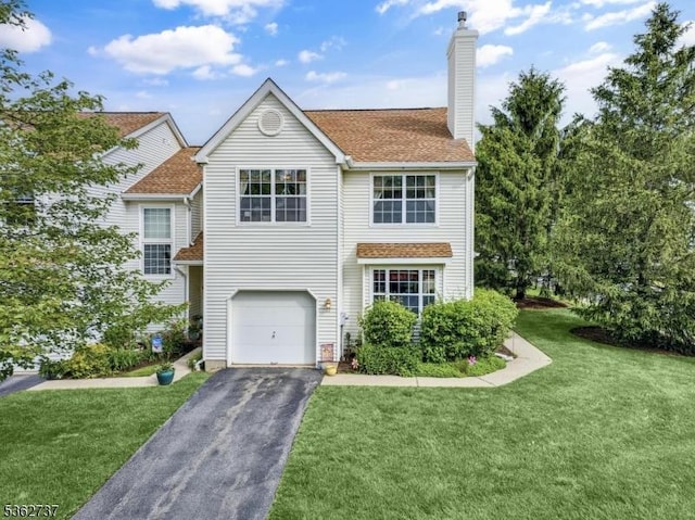 17 Willow Cir, Hamburg Boro, NJ 07419 - traditional-style home featuring asphalt driveway, a front yard, a chimney, and an attached garage
