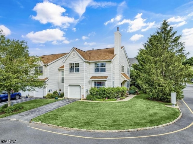 17 Willow Cir, Hamburg Boro, NJ 07419 - traditional-style house featuring driveway, an attached garage, a chimney, and a front yard