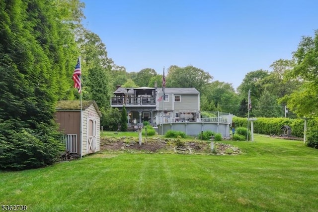 19 Paderewski Rd, Jefferson Twp, NJ 07438 - view of green lawn with a wooden deck