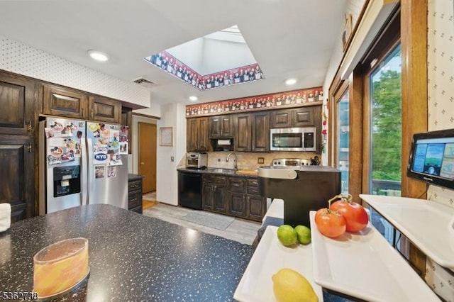 19 Paderewski Rd, Jefferson Twp, NJ 07438 - kitchen with stainless steel appliances, a sink, dark brown cabinetry, decorative backsplash, and dark countertops