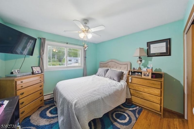 19 Paderewski Rd, Jefferson Twp, NJ 07438 - bedroom featuring a baseboard radiator, wood finished floors, a ceiling fan, and a closet