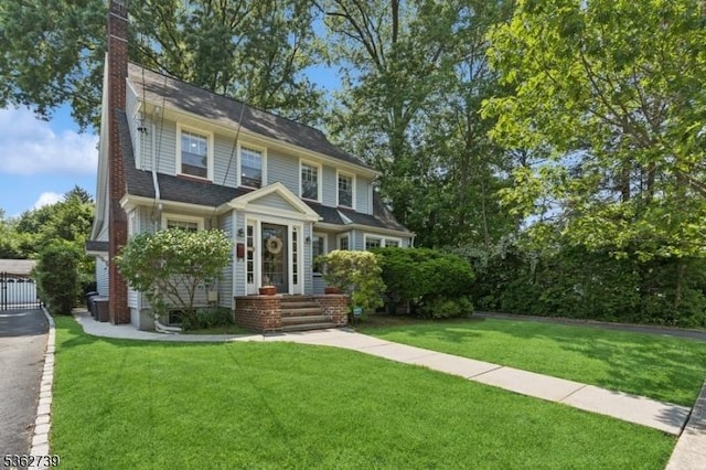 174 Garfield Pl, Maplewood Twp, NJ 07040 - view of front of property featuring a chimney and a front yard