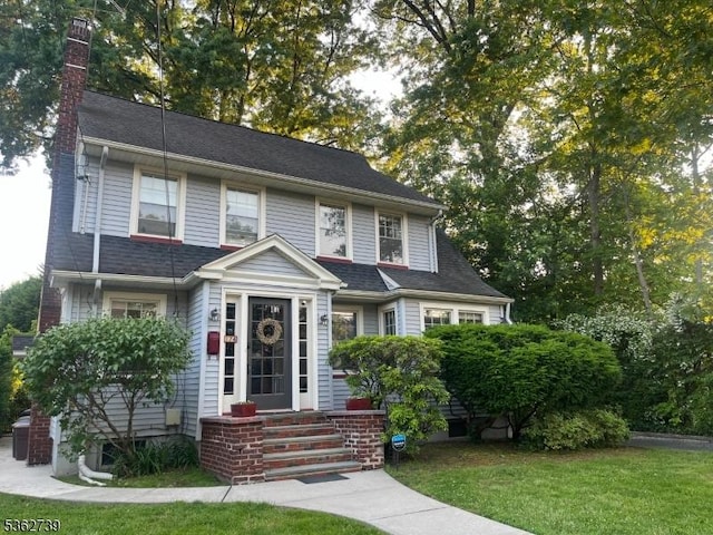 174 Garfield Pl, Maplewood Twp, NJ 07040 - view of front of home with a chimney and a front lawn