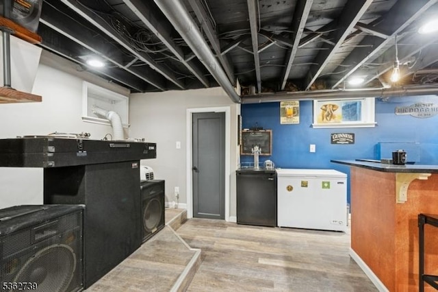 174 Garfield Pl, Maplewood Twp, NJ 07040 - finished below grade area with refrigerator and wood finished floors