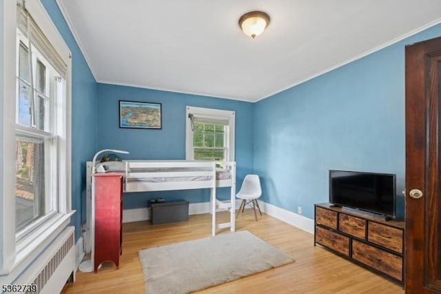 174 Garfield Pl, Maplewood Twp, NJ 07040 - bedroom with radiator, crown molding, wood finished floors, and baseboards