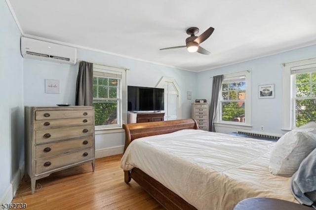 174 Garfield Pl, Maplewood Twp, NJ 07040 - bedroom with a wall mounted air conditioner, baseboards, light wood finished floors, and a ceiling fan
