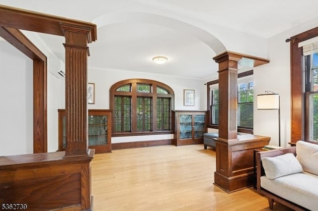 174 Garfield Pl, Maplewood Twp, NJ 07040 - sitting room with ornate columns, arched walkways, light wood finished floors, and crown molding
