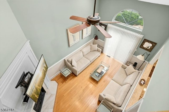 3607 Park Pl, Springfield Twp, NJ 07081 - living room with wood finished floors, a ceiling fan, and a towering ceiling