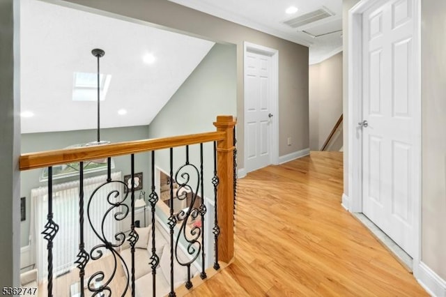 3607 Park Pl, Springfield Twp, NJ 07081 - hall featuring an upstairs landing, wood finished floors, a skylight, and recessed lighting