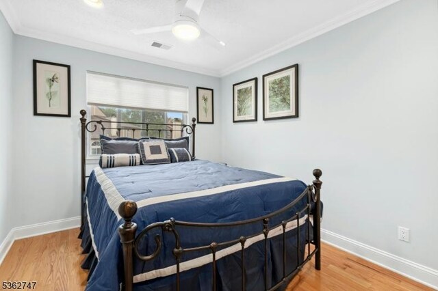3607 Park Pl, Springfield Twp, NJ 07081 - bedroom with ornamental molding, wood finished floors, and a ceiling fan
