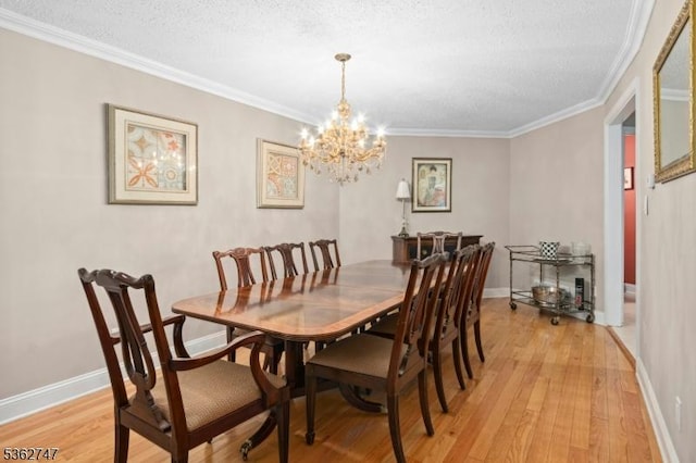 3607 Park Pl, Springfield Twp, NJ 07081 - dining area with light wood-type flooring, ornamental molding, a chandelier, and a textured ceiling
