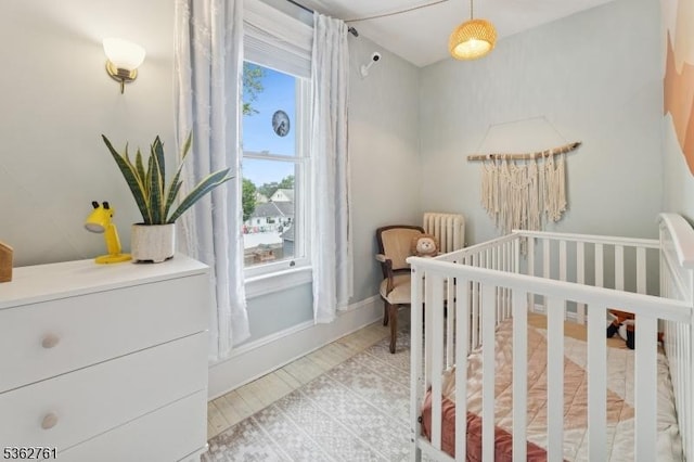 30 Hillcrest Ter, Verona Twp, NJ 07044 - bedroom featuring a crib and radiator heating unit