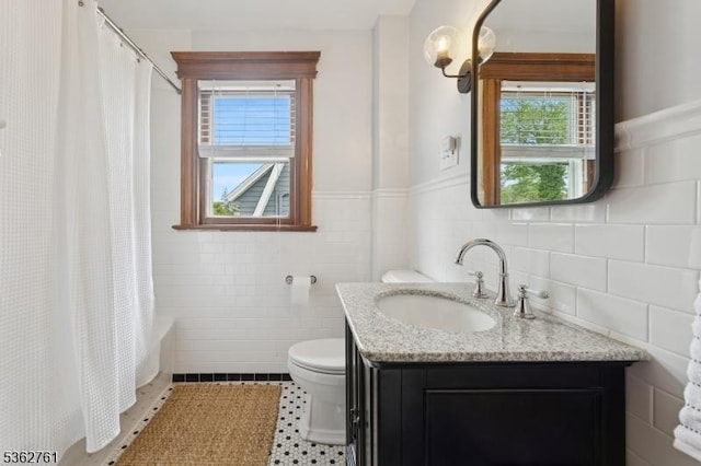 30 Hillcrest Ter, Verona Twp, NJ 07044 - bathroom with tile walls, vanity, plenty of natural light, shower / bathtub combination with curtain, and tile patterned flooring