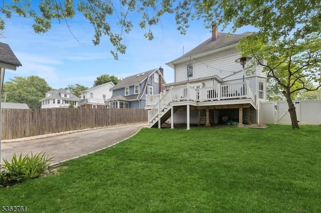 30 Hillcrest Ter, Verona Twp, NJ 07044 - rear view of property featuring stairway, a wooden deck, a fenced backyard, a chimney, and a gate