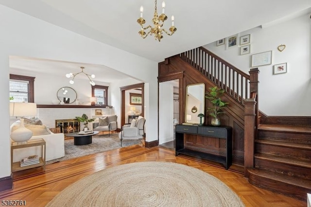 30 Hillcrest Ter, Verona Twp, NJ 07044 - living room with a chandelier, plenty of natural light, and stairs