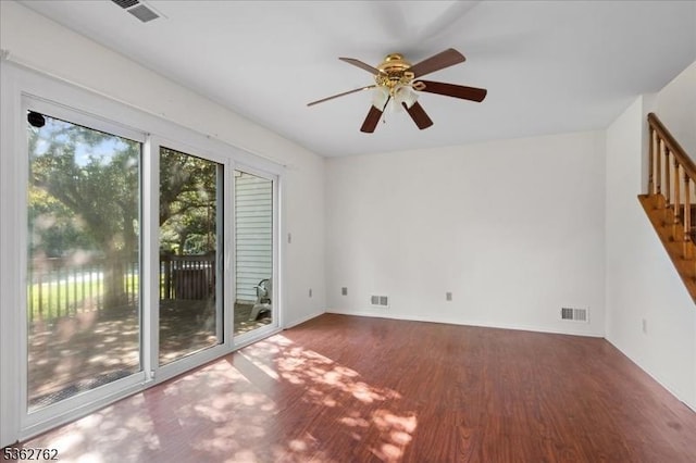 450 Saint Giles Ct, Franklin Twp, NJ 08873 - empty room with wood finished floors, stairway, ceiling fan, and baseboards